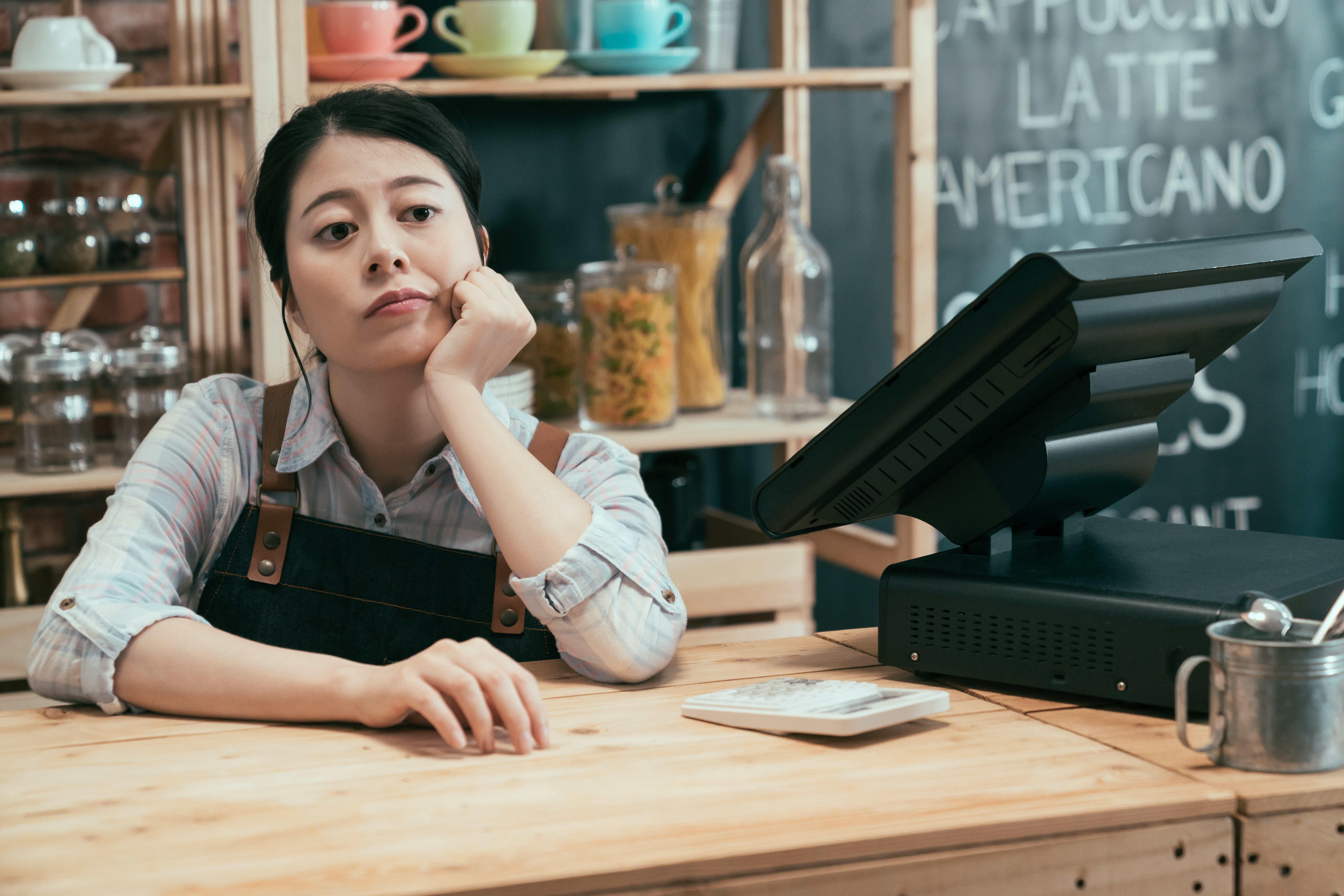 Upset business owner waiting for customers